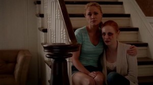 Sookie Stackhouse (Anna Paquin) and Jessica Hamby (Deborah Ann Woll) cry over Bill Compton's (Stephen Moyer) Hep-V in HBO's True Blood Season 7 Episode 6 (entitled 'Karma')
